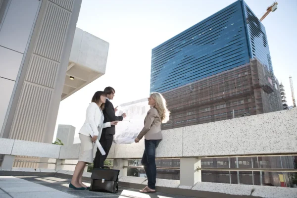 Businesspeople having a meeting outdoors Businesspeople having a meeting outdoors