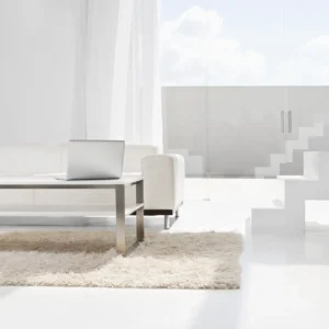 Spain, Modern living room with laptop and stairs