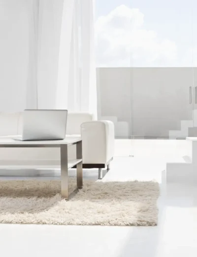Spain, Modern living room with laptop and stairs