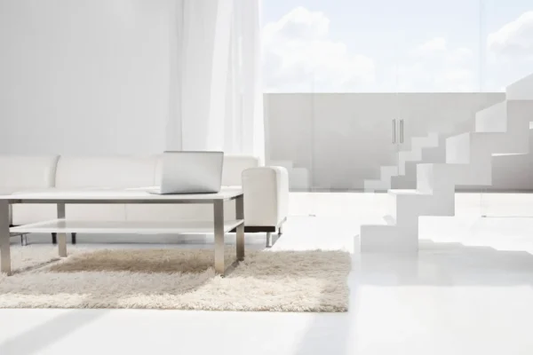 Spain, Modern living room with laptop and stairs Spain, Modern living room with laptop and stairs
