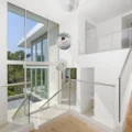 Residential interior with windows and a ceiling fan in the corner A residential interior with windows and a ceiling fan in the corner
